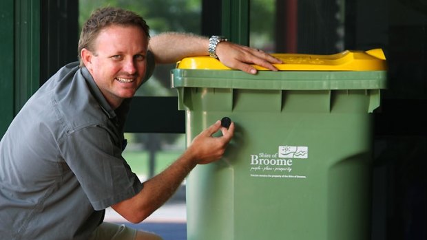 Shire of Broome waste coordinator Jeremy Hall with one of the radio frequency ID tags being placed on Broome bins.