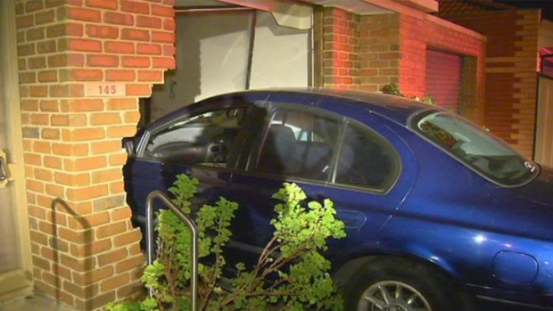 The blue Ford Falcon ploughed into the front room of the Mill Park house.
