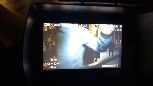 Cardinal Pell's security shoving an Australian TV camera.