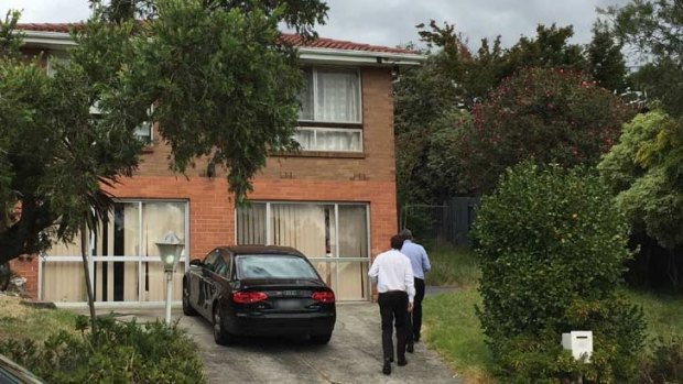 Police visit a home near where the girl was found.