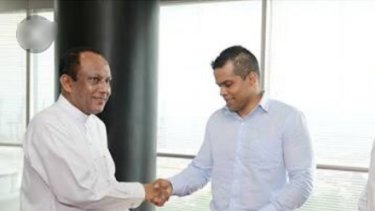 Happier times: Arjuna "Arj" Samarakoon (right) shakes hands with Sri Lanka's Minister for State Enterprise Development, Lakshman Yapa Abeywardena.