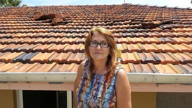 Girrawheen grandmother Joyce Ajdukovic believes a low-flying plane caused damage to her roof. 