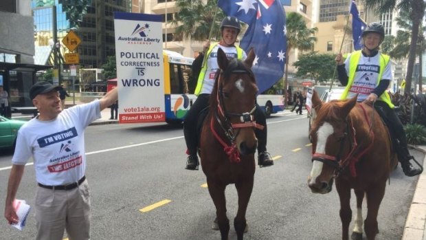 Australian Liberty Alliance campaigners take to horseback in the Brisbane CBD.
