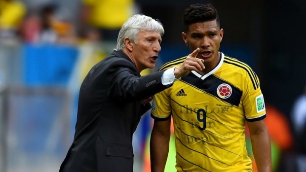 Honorary citizen ... Columbia's head coach Jose Pekerman speaks to Teofilo Gutierrez during the Group C match between Colombia and Ivory Coast.