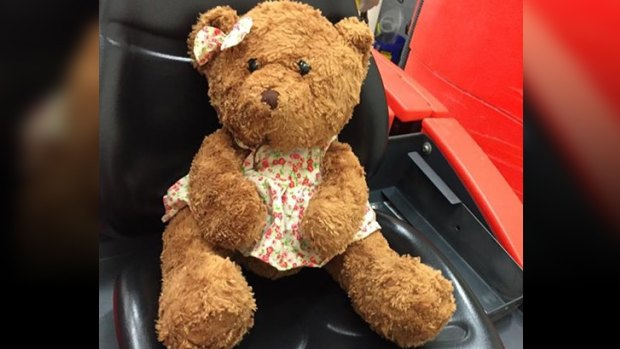 The bear, wearing a floral dress, was left at Perth Airport.