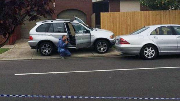 Police investigate damaged cars at the scene of the shooting in Lalor. 