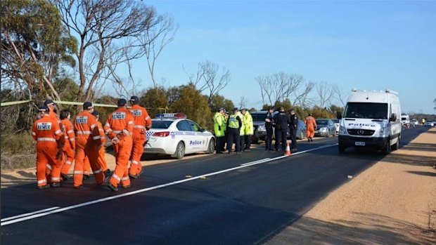 Police and emergency services gather at the scene on Thursday.