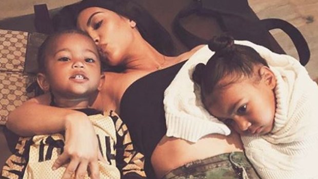 Kim Kardashian poses with children Saint, 22 months, and North, four.
