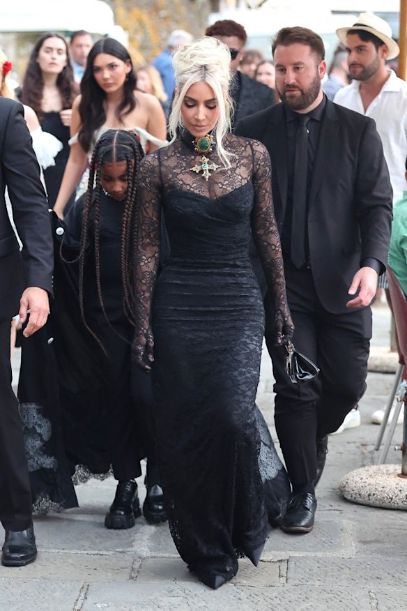 Kim Kardashian arrives in all black for her sister's wedding.