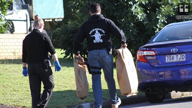 Police seize evidence after a raid in Ormiston on Tuesday morning.