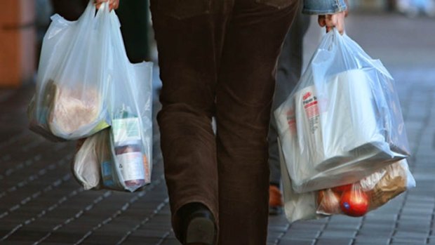 Plastic bags will disappear from Coles and Woolworths in 2018.