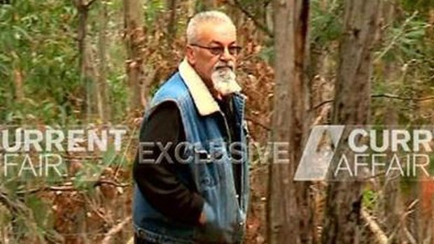 Video still shows Vasko Ristevski emerging from the scrub during filming of Nine's A Current Affair.