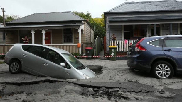 Residents of the street were shocked to see to the sinkhole had swallowed a car. 
