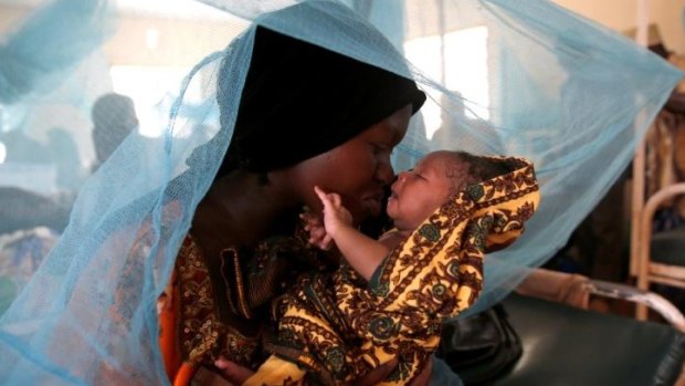 Mariam Kasim, a refugee from the Democratic Republic of Congo carries her one day old baby Sarah Bonamaxi at the maternity ward at the main hospital in Kakuma Refugee Settlement.