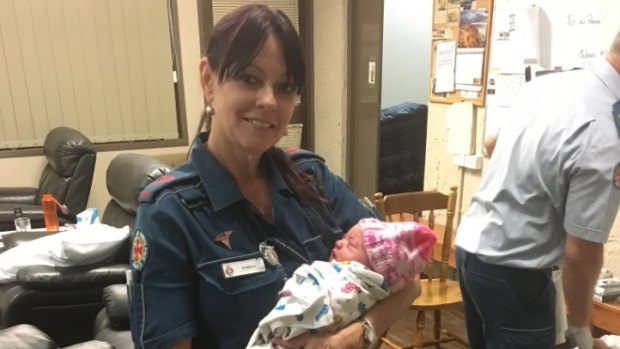 Queensland paramedic Pam with the baby girl. 
