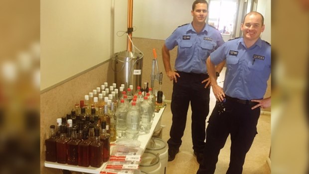 Police officers in Broome with the seized alcohol. 