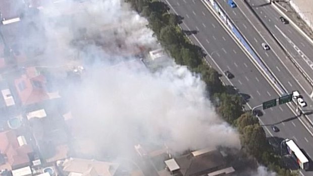 A "suspicious" grass fire at Bracken Ridge threatened nearby homes on Sunday afternoon.