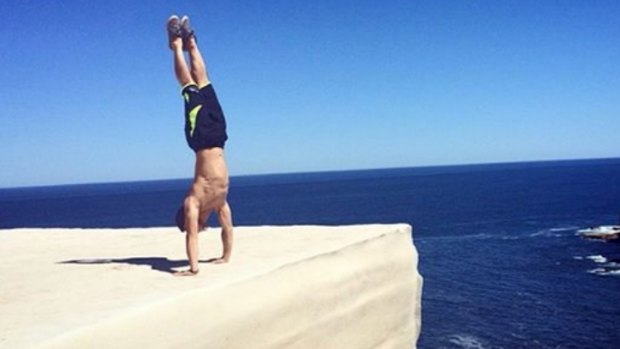 If performing a handstand on Wedding Cake Rock in Royal National Park looks dangerous, that's because it is.