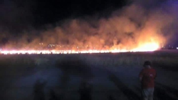 A large grass fire sparked by a flare in Altona on New Year's Eve. 