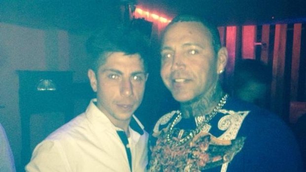 Mahamd Hassan (left) posing with former bikie Toby Mitchell. Mr Hassan was shot and killed in a motel last weekend.