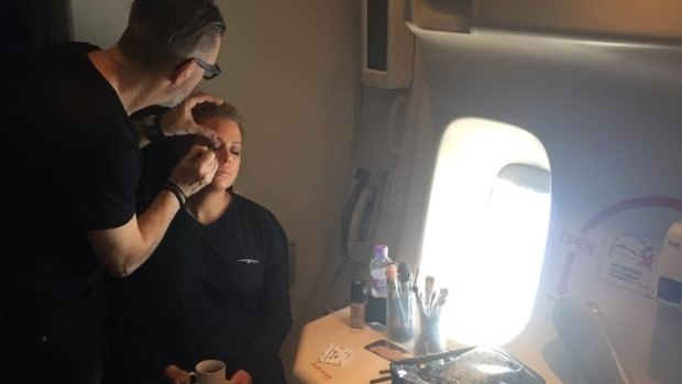 Channel Seven make-up artist Garry Siutz working on Samantha Armytage, on the descent into New York. 