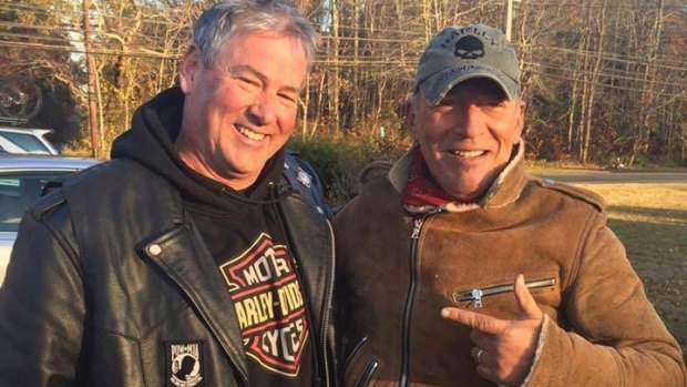 Dan Barkalow, left, and Bruce Springsteen poses for a photo in Wall Township, N.J. Barkalow and a group from the Freehold American Legion was riding after a Veterans Day event Friday when they pulled over to help a stranded motorcyclist who turned out to be The Boss.