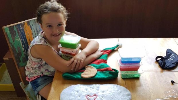 Eight-year-old Tumut girl Una Skein is selling slime at the Southside Farmers Market in Canberra.