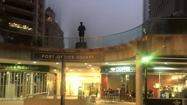 Fog covers up Post Office Square from Queen Street, hiding the tall buildings behind.