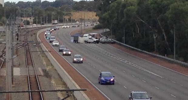 A forensic tent was set up by homicide detectives on the Mitchell Freeway on Saturday after the discovery of a woman's body.