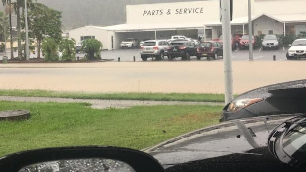 Flooding turned Halls Road, Coffs Harbour, into a brown river on Wednesday.