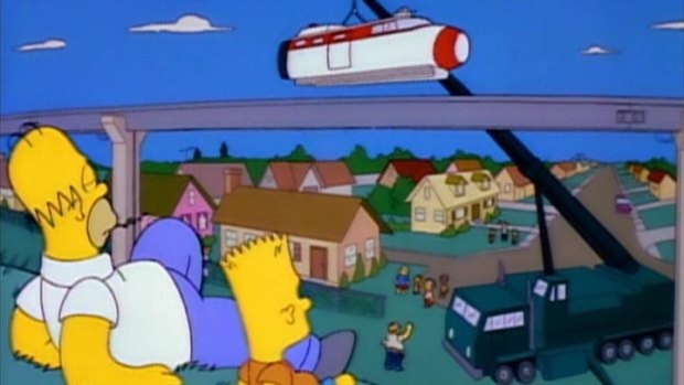 The Simpsons watch on as Springfield's monorail is built.