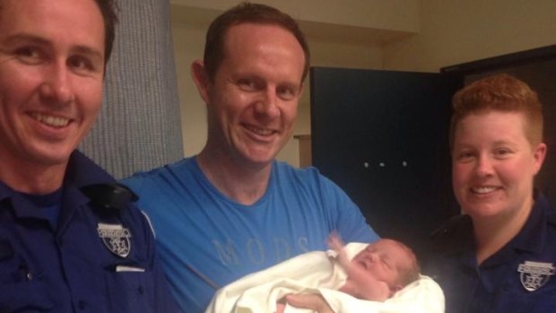 Leichhardt mayor Darcy Byrne, pictured with paramedics, delivered his baby girl at home on Tuesday night.