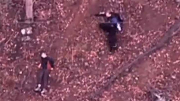 Luke Shambrook, 11, being rescued after he was spotted from a helicopter.