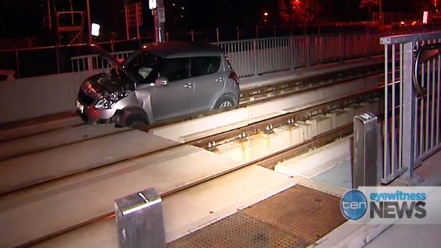 The driver of a car that became stuck on tram tracks on the Gold Coast on Monday fled the scene before police arrived.