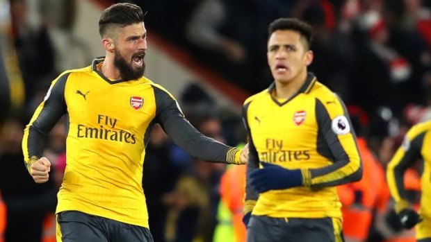 Stark contrast: Olivier Giroud is elated by the equaliser against Bournemouth, as Sanchez appeared visibly frustrated at the dropped points.