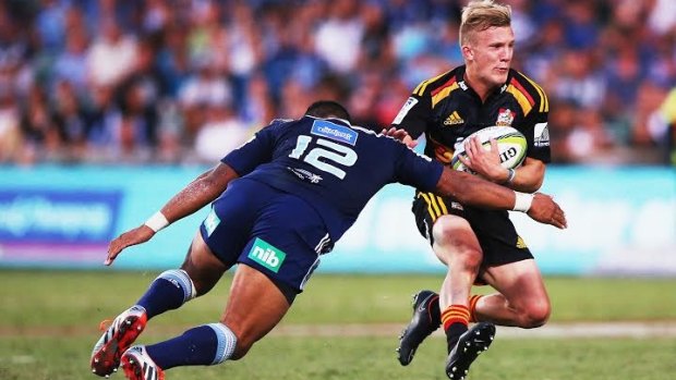 Damian McKenzie has a go at the Blues line in Albany.