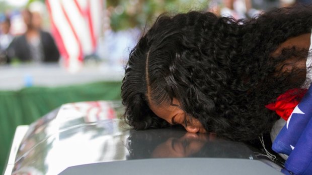 Myeshia Johnson kisses the casket of her husband, Sargeant La David Johnson, during his burial service in Hollywood, Florida.