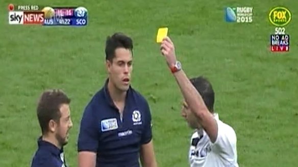 Harsh call: Sean Maitland, centre, receives a yellow card.  