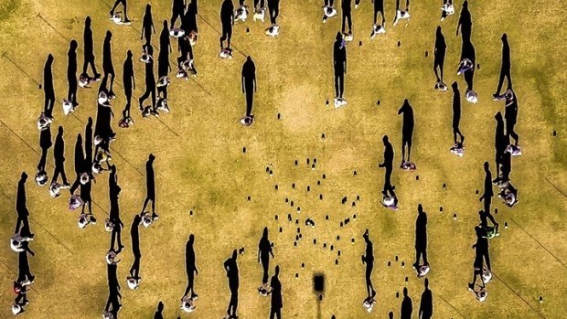 The drone perfectly captured the shadows of each bowler as they walked to collect their bowls. 