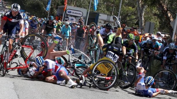 They all fall down: A group of riders take a tumble near the finish of Friday's stage of the Tour Down Under.