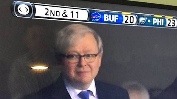 Kevin Rudd gives a hair flick for the cameras at NFL game