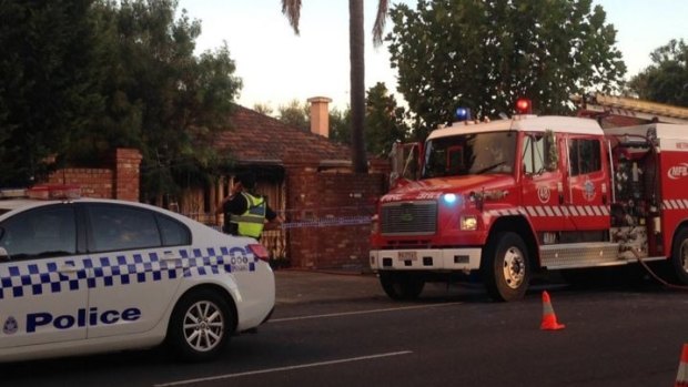 Police outside the fire-damaged Ascot Vale home of Des 'Tuppence' Moran.