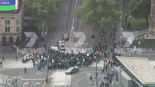 Protesters blocking the intersection of Flinders and Swantson streets.