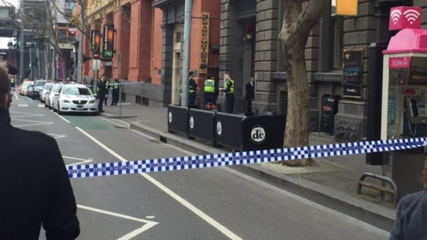 Police at the scene on the corner of Bourke and Spencer streets.