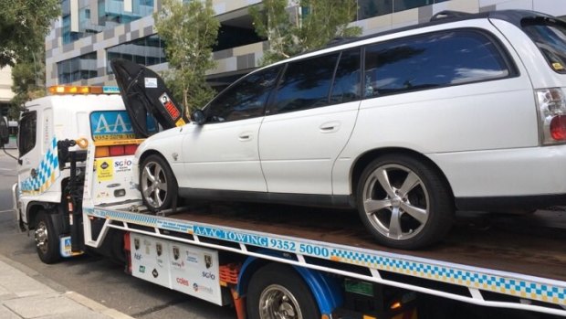 The woman's car was towed from outside the court. 
