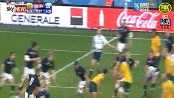 Controversial: Scotland's Jon Welsh instinctively grabs the ball.