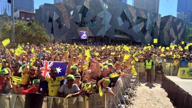 Cricket fans converge on Federation Square to cheer on the Australian world title holders.