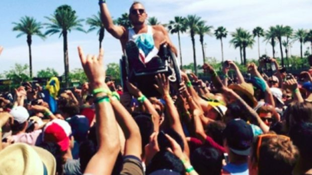 Dylan Alcott crowdsurfs at Coachella music festival in the US.