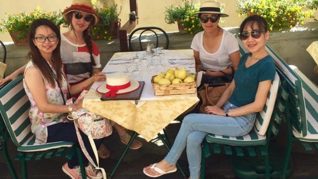 Suria Intan, left, pictured in Italy on August 13 with her three travel companions. 