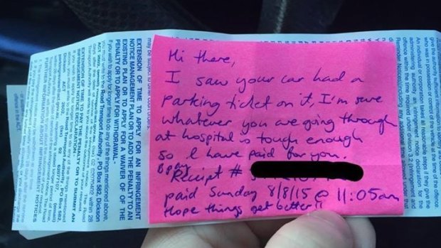 The post-it note attached to the parking fine.
